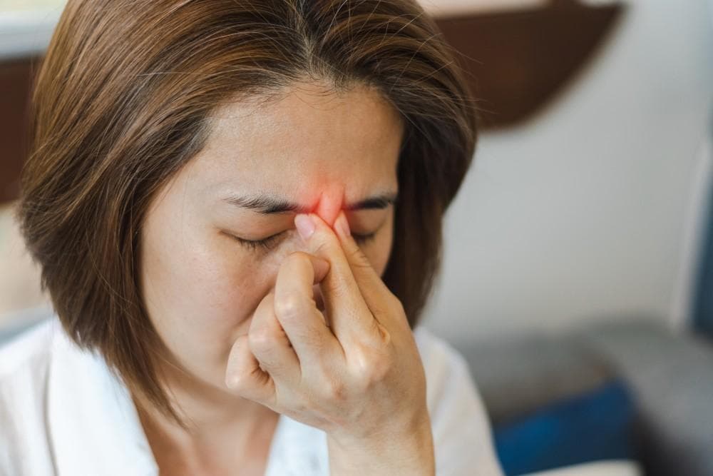 Person with facial pressure and sinus congestion pain - chiropractor San Antonio TX